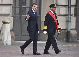 France’s president gets a ceremonial welcome as he starts a 2-day state visit to Sweden