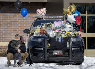 A shaken Minnesota community gets some answers on the killings of 2 officers and 1 firefighter