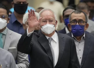 Malaysia halves prison term for ex-Prime Minister who oversaw multibillion-dollar 1MDB thefts