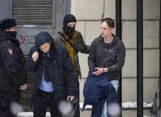 US journalist marks a year in a Russian prison as courts keep extending his time behind bars