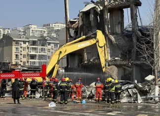 An explosion in a building outside Beijing kills 2 people and injures 26