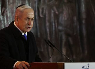 Netanyahu uses Holocaust ceremony to brush off international pressure against Gaza offensive