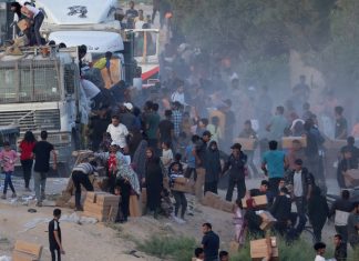 More aid getting from US pier to people in Gaza, officials say, after troubled launch