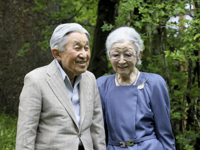 Capture Former Japanese Emperor Akihito and former Empress Michiko take a walk in Nikko Tamozawa Imperial Villa Memorial Park in Tochigi Prefecture, eastern Japan, on May 28, 2024