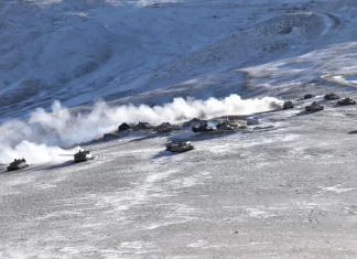 An Indian military tank sinks while crossing a river in a region bordering China, killing 5 soldiers