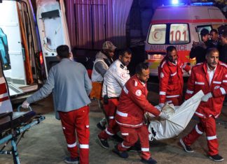 Gaza rescuers say Israeli strikes kill 58, hit flour trucks