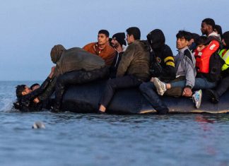 A boat carrying migrants sinks off the Libyan coast with at least 19 people dead and 42 missing