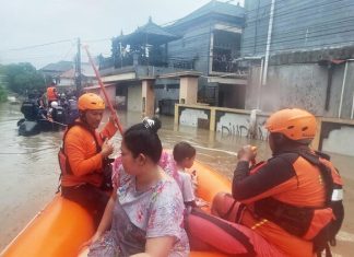 Flash floods in Indonesia leave at least 15 dead and 10 missing