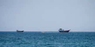 Tanker Hit by Projectile Off Oman Amid Rising US-Iran Tensions in Strait of Hormuz