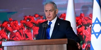 At Oct. 7 ceremonies, PM vows to settle scores. Others urge accountability for massacre